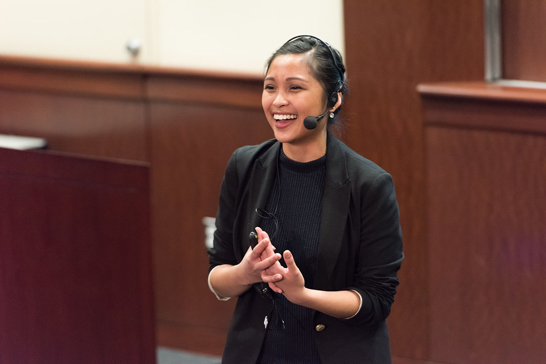 A woman speaking wearing a headset during the 2015 JLive competition
