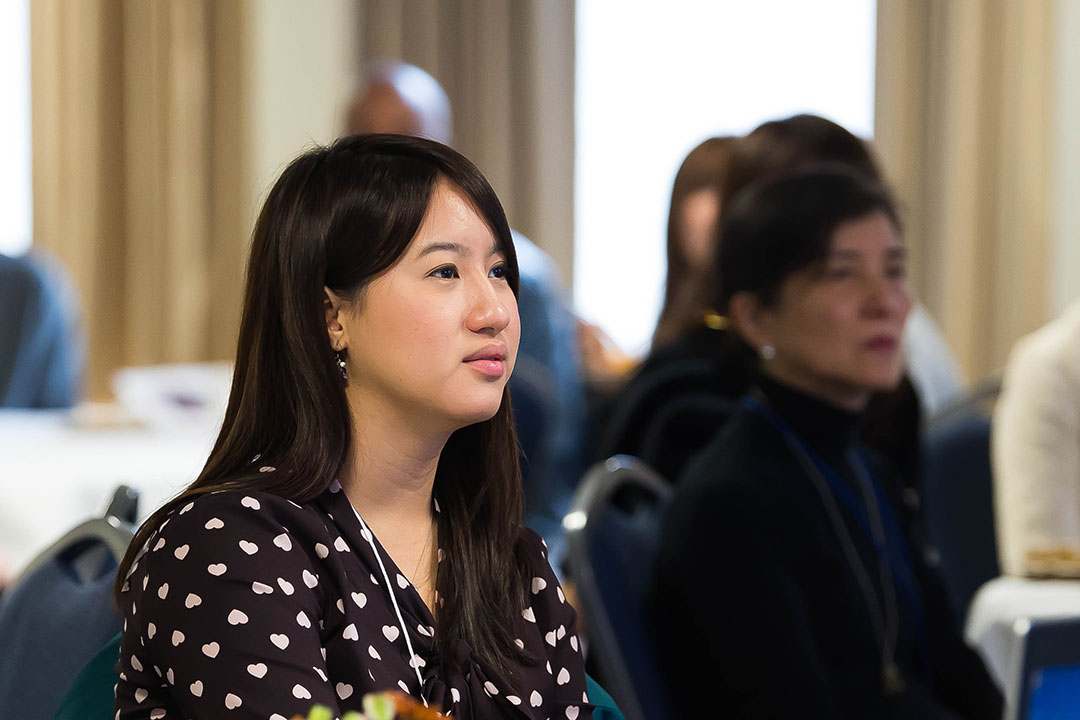 A woman sitting in a classroom