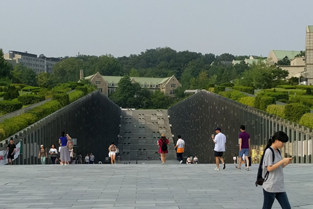 Students walking around campus at Ewha