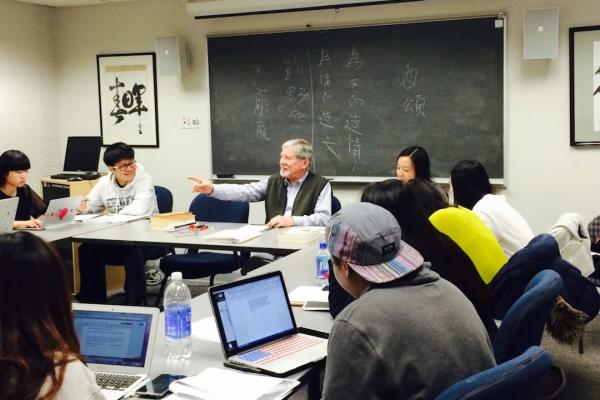 A professor teaching in a Chinese Poetry classroom